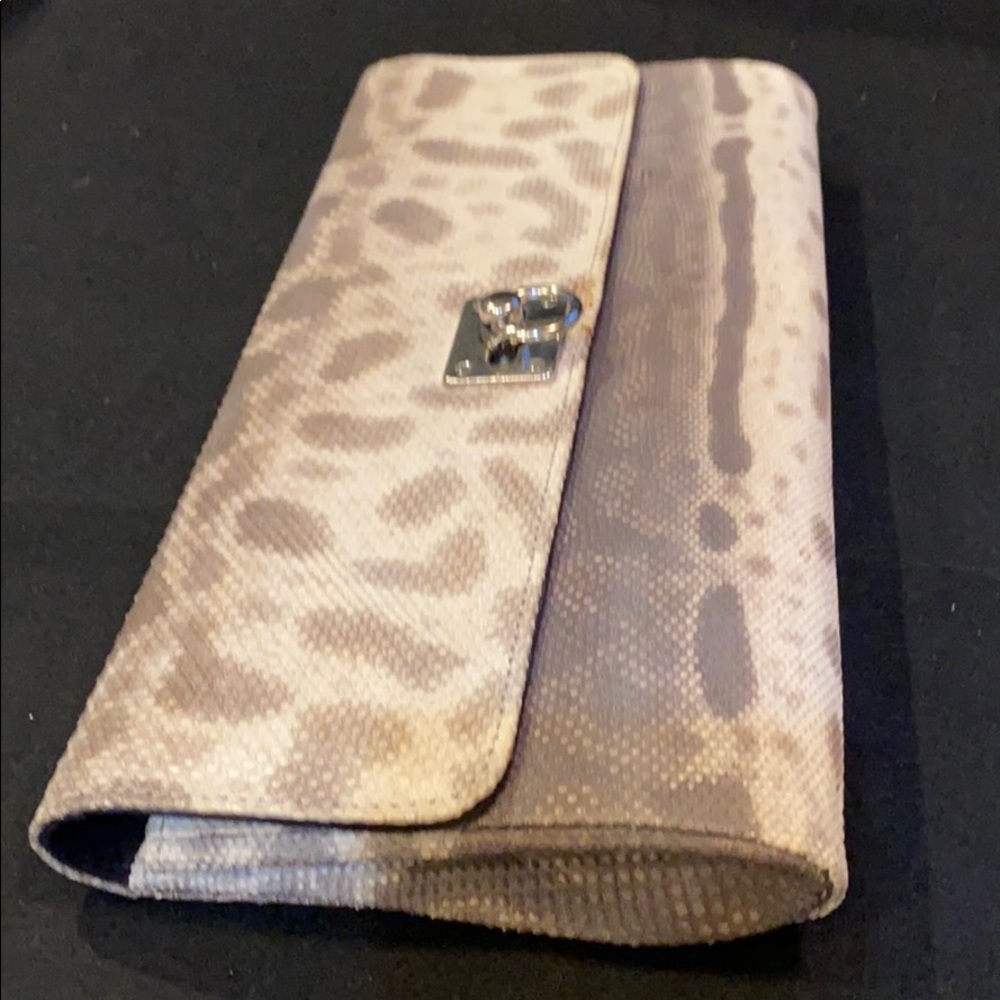 100% authentic snake skin envelope .